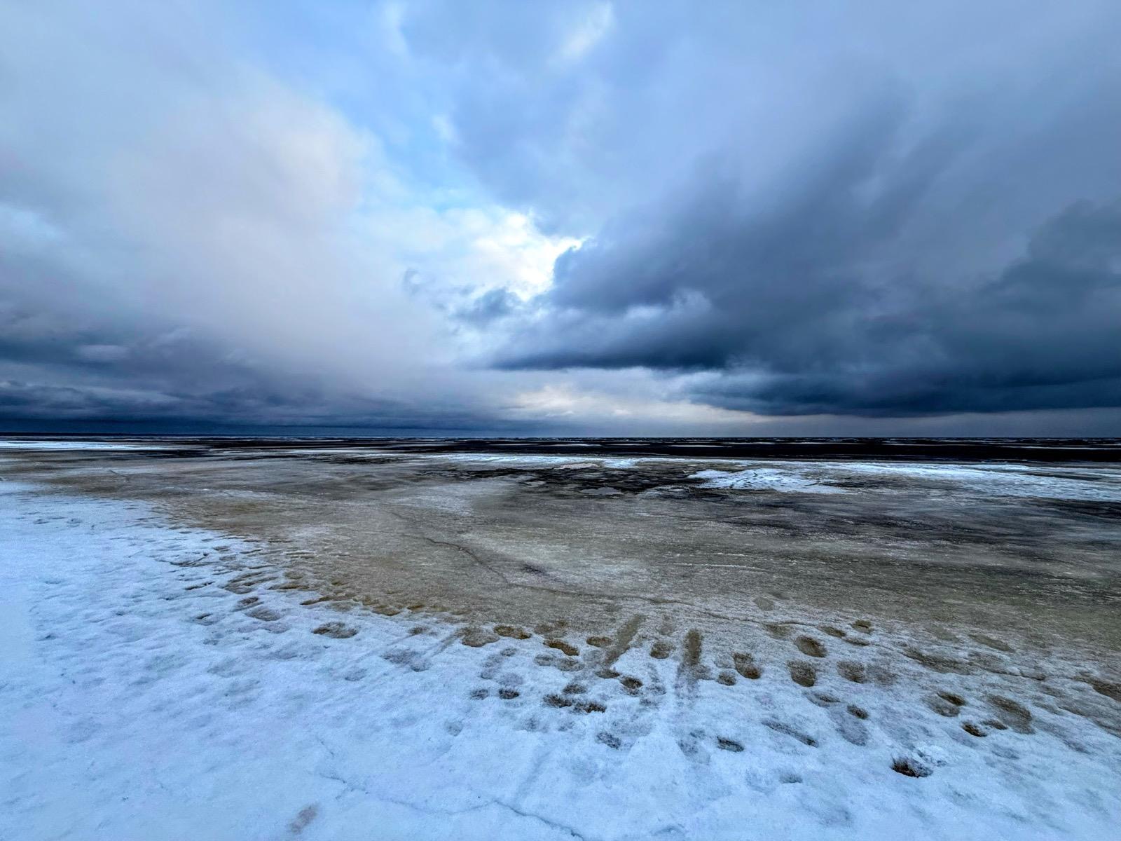 The frozen Baltic shore under a heavy winter sky
